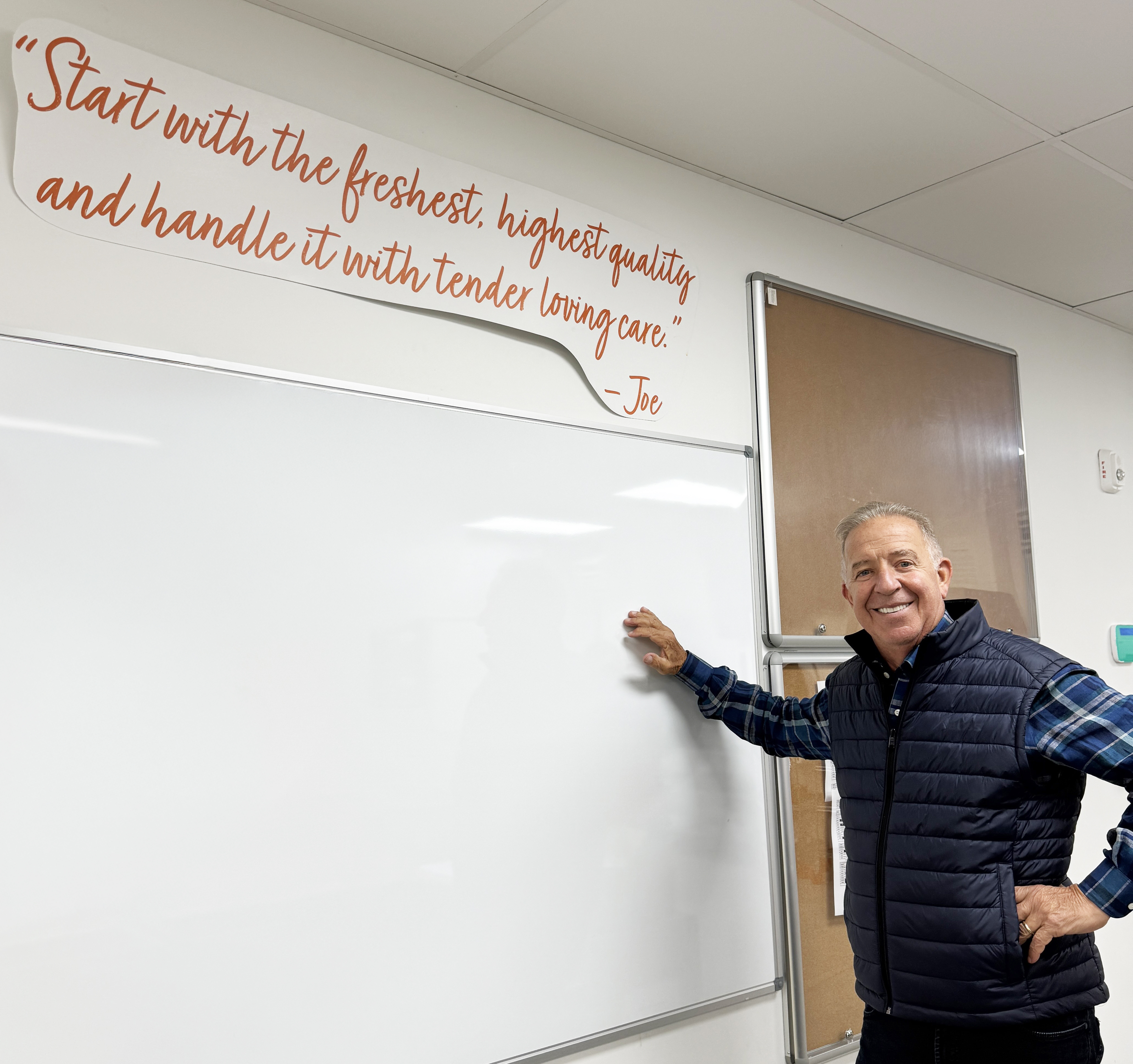 Owner Joe Gurrera in front of his mission statement