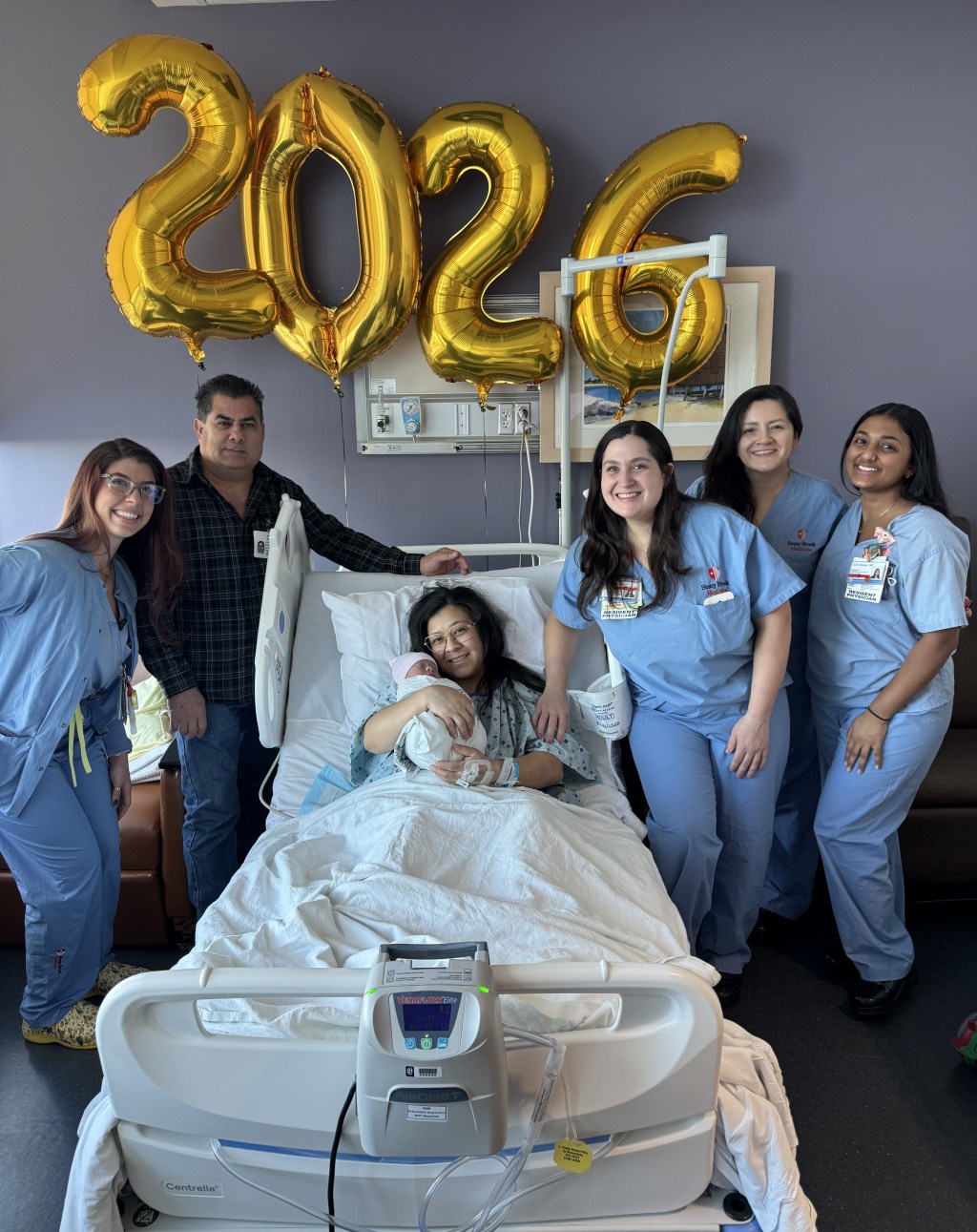 Mariela Enriquez Flores and Jose Ramirez with their son Liam and the maternity team at Stony Brook University Hospital